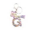Letter G keychain in resin with purple tassel, butterfly charm and golden ring - Letter G (Style 7)