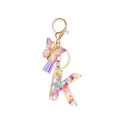 Resin letter K keychain with glitter stars, purple tassel and butterfly charm - Style 11