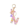 Resin initial N keychain with colorful floral sequins, purple tassel, and butterfly charm - Style 14