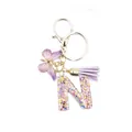 Letter N resin keychain with purple butterfly charm and sequin-filled glitter letter - Style 14