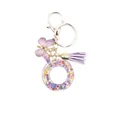 Resin letter O keychain with purple butterfly, floral petals and tassel decoration - Style 15