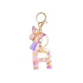 Letter R resin keychain with purple butterfly, floral glitter and soft tassel - Letter R