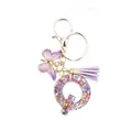 Purple resin letter Q keychain with glitter stars, butterfly pendant and silk tassel - Style 17