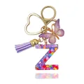Portachiavi lettera Z in resina con nappa viola, farfalla e cuori glitterati colorati - Lettera Z (Stile 24)