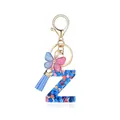 Porte-clés lettre Z en résine avec paillettes, pompon bleu et pendentif papillon - Lettre Z-Thème Paillettes Bleues (QS2157)