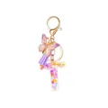 Resin letter T keychain with purple dried flowers, butterfly charm and silk tassel - Style 20