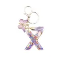Resin letter X keychain with purple butterfly charm and tassel featuring glitter stars - Style 24