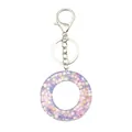 Porte-clés en résine avec paillettes fleurs roses et violettes dans un anneau brillant - Style Cercle