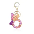 Porte-clés en résine dégradé violet et orange avec papillon scintillant et pompon élégant - Lettre O-Thème Floral Violet Orange (QS2157)