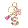 Pink resin alphabet S keychain with butterfly pendant and heart-shaped colorful sequins - Letter S (Style 18)