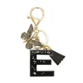 Porte-clés lettre E en résine noire avec papillon doré et gland décoratif - Lettre E (Style 5)