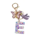 Porte-clés lettre E en résine avec papillon violet à paillettes et pompon en daim - Modèle Lettre E (Style 5)