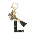 Porte-clés lettre L en résine noir et or avec breloque papillon et pompon en soie - Lettre L (Style 12)