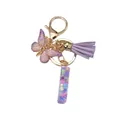 Porte-clés papillon violet en résine avec ailes dégradées et pompon en cuir doré - Style Papillon & Frange (Style 8)