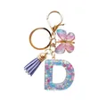 Porte-clés lettre D en résine avec paillettes, pompon violet et breloque papillon - Lettre D Paillettes Série Violette (QS2157)