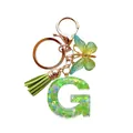 Porte-clés lettre G en résine verte avec paillettes, papillon et pompon vert - Lettre G Paillettes Vert Tendre (QS2157)