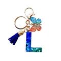 Porte-clés lettre L en résine avec paillettes bleues, pompon et pendentif papillon - Lettre L Paillettes Dégradé Bleu-Cyan (QS2157)