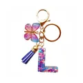 Porte-clés lettre L en résine avec papillon à paillettes violettes et pompon bleu foncé - Lettre L Paillettes Dégradé Violet-Rose (QS2157)