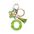 Porte-clés lettre O en résine verte avec paillettes étoilées, papillon et pompon assorti - Lettre O en Résine Vert Vif (QS2157)