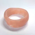 Thick round resin bangle in translucent pink with elegant marble swirl patterns - Flesh Pink