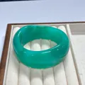 Minimalist wide emerald green resin bangle with smooth polished finish and marbled texture - Emerald Green
