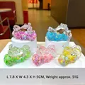 Detail view showing five colorful motorcycle keychains with liquid sand and glitter inside - Mixed Colors (Luminous Snowflake)