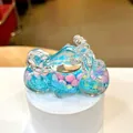 Macro view of motorcycle drift bottle with blue liquid and drifting snowflakes - Blue (Luminous Snowflake)