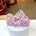 Close-up of a pink acrylic motorcycle drifting bottle with sparkling glitter and stars - Purple (Luminous Snowflake)