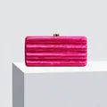 Detail of rose pink acrylic clutch with water ripple texture and gold metal push lock - Rose Red