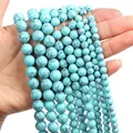 Detail of blue turquoise round beads showing various sizes and black mesh textures - Blue Turquoise