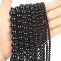 Multiple sizes of polished black agate round beads ranging from 4mm to 12mm diameter - 10mm / Black Agate