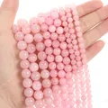 Multiple sizes of natural rose quartz round beads strands with translucent pink texture - Rose Quartz