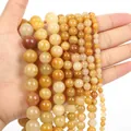 Polished natural yellow tiger eye beads available in various sizes from 4mm to 12mm - Old Yellow Jade