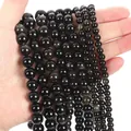Natural gold sheen obsidian beaded bracelets showing golden cat-eye effect on black stones - Gold Obsidian