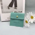 Mint green suede jewelry envelope pouch with gold button and handmade logo - Emerald