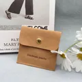 Camel suede jewelry envelope bag with golden snap button and handmade engraving - Chocolate