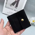 Black suede jewelry envelope pouch with gold snap button and handmade jewelry logo - Black