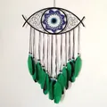 Bohemian Evil Eye dreamcatcher wall decor with green feathers and black knitted frame - Green Evil Eye