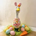 Easter goose figurine with rabbit hat and egg pattern scarf for holiday garden decor - Easter Bunny Outfit