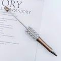 Rose gold beaded DIY ballpoint pen featuring elegant white pearl and rhinestone accents - Champagne Gold