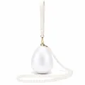Detail of egg-shaped acrylic evening bag with pearl chain and golden metal clasp - Small Ball White