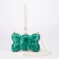 Detail of green marble acrylic evening clutch with pearl strap and gold hardware - Bow Shape Green Marble