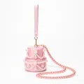 Detail of pink acrylic tiered cake evening bag with faux marble texture and pearl chain - Cake Pink
