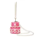 Close-up of pink shell acrylic evening bag featuring layered pearl tassels and marble finish - Cake Shape Rose Red