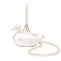 Detail of creative duck-shaped acrylic bag with pearl crossbody chain and golden hardware - Little Duck