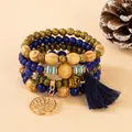 Detail of bohemian layered beads with a gold tree of life charm and blue silk tassel - Sapphire Blue