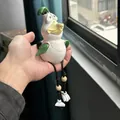 Detailed view of handmade funny chicken garden statue with rustic rope legs and wooden beads - Green