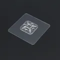 Transparent adhesive wall hook patch for shelf mounting on a black background - Cable Tie Mount (Without Tie) / Clear