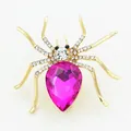 Detailed close-up of a golden spider brooch featuring pink teardrop gemstone and crystals - Exquisite Pink-Purple Rhinestone Spider Design Brooch