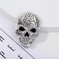 Silver vintage skull brooch with floral engravings and black eye detail for Halloween - Scroll Pattern Carved Skull Style / Antique Silver